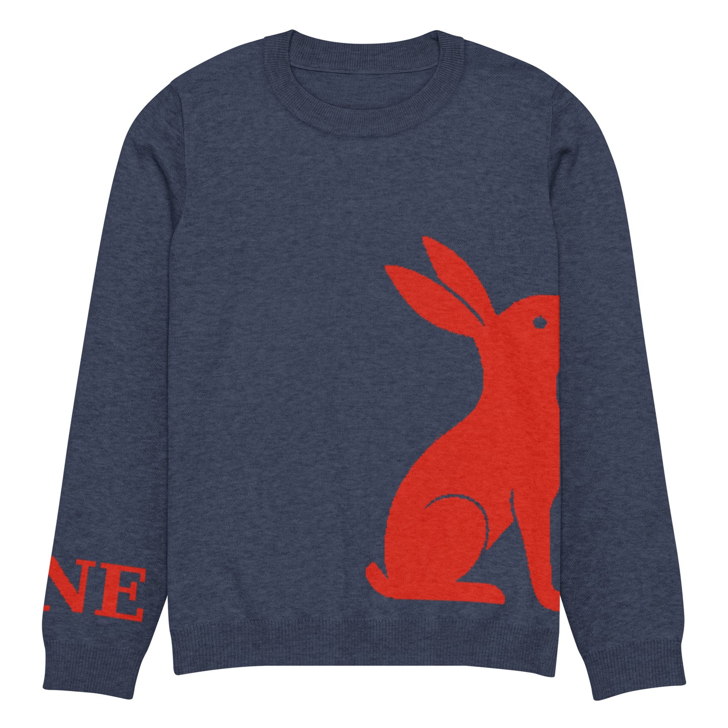 Detalle ampliado del logo rojo KÖNE y acabado del puño en tejido elástico reforzado.