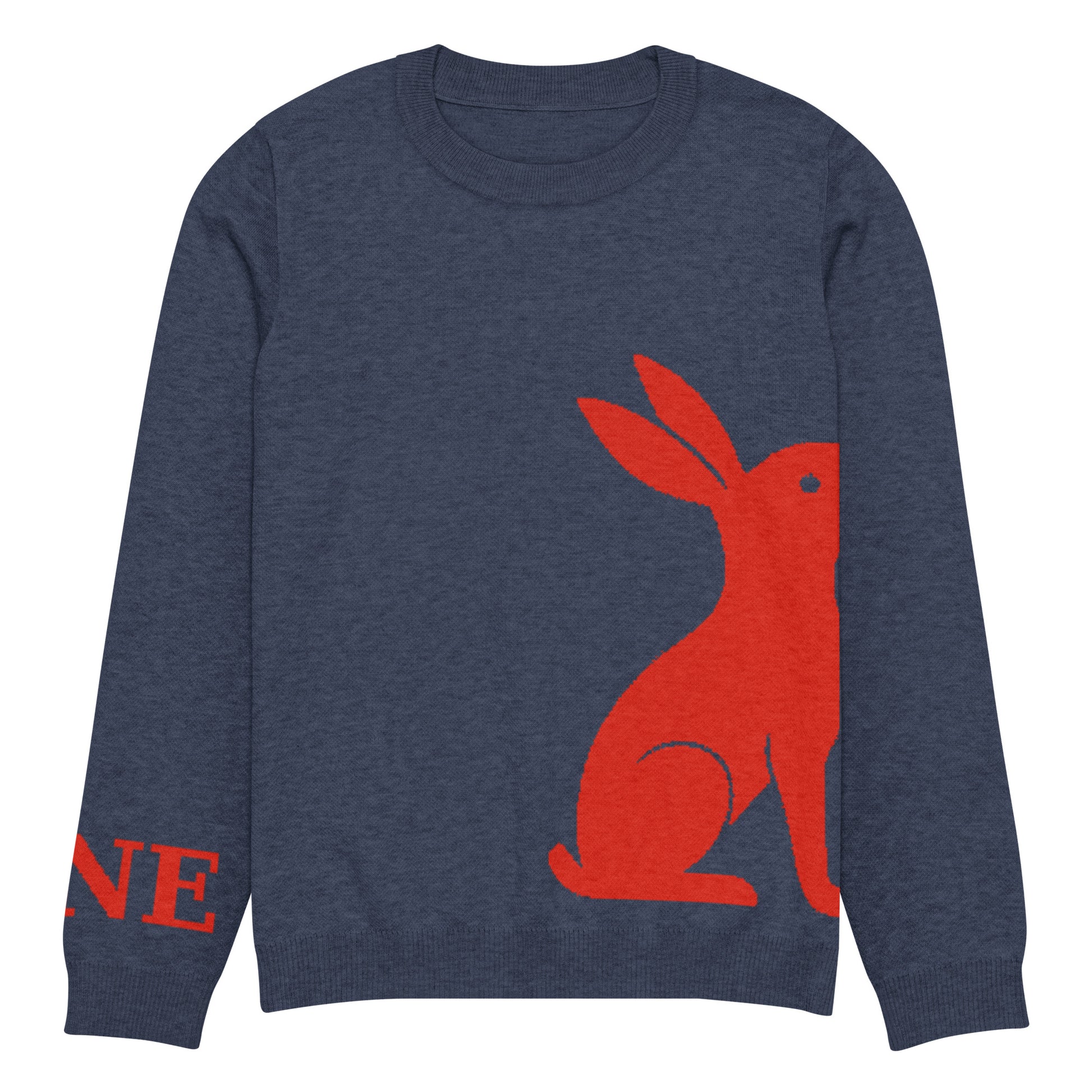 Detalle ampliado del logo rojo KÖNE y acabado del puño en tejido elástico reforzado.