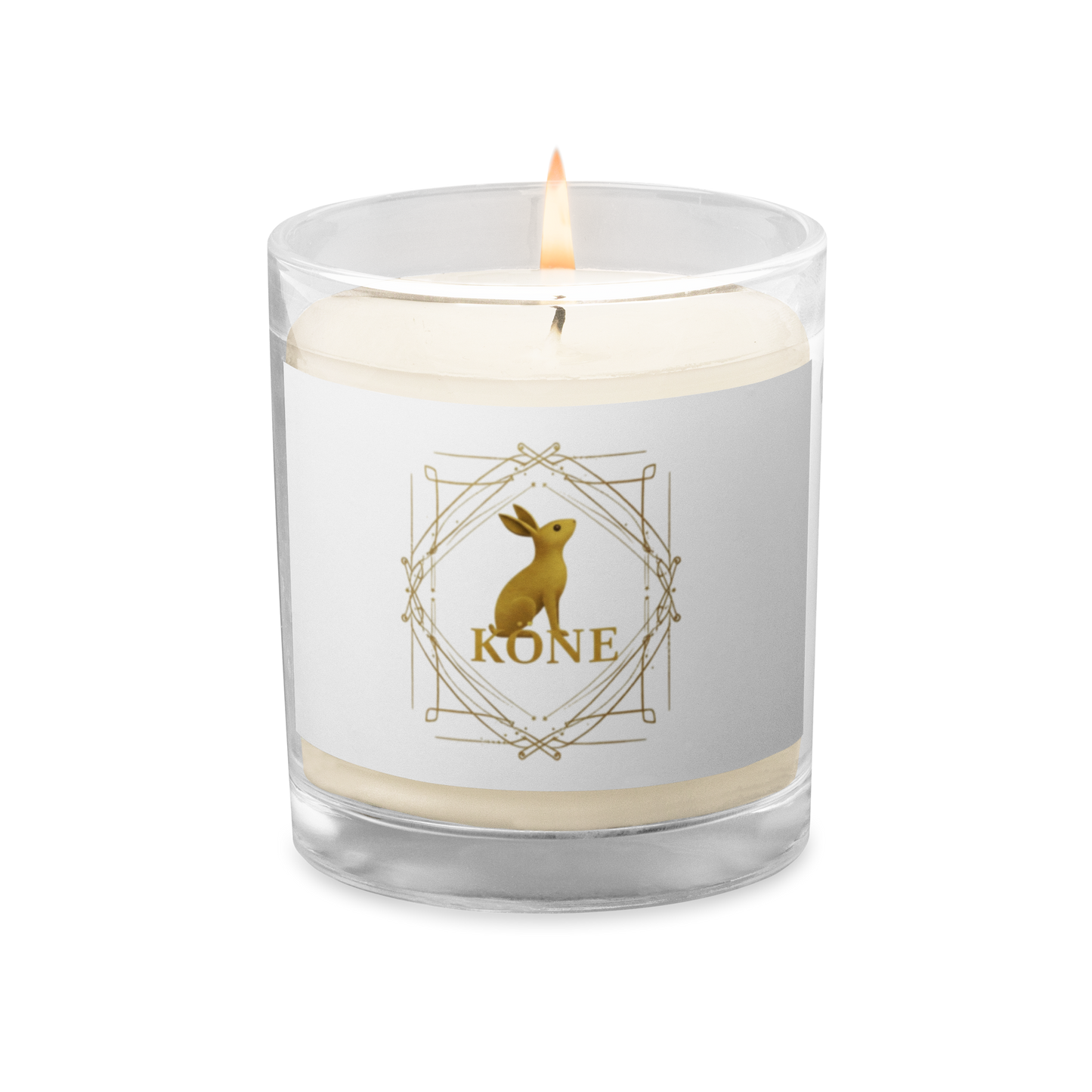 Vela de soja KÖNE blanca con logo dorado sobre fondo claro y textura suave