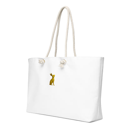 Bolsa KÖNE Weekender blanca vista lateral, con textura premium y asas de cuerda trenzada.
